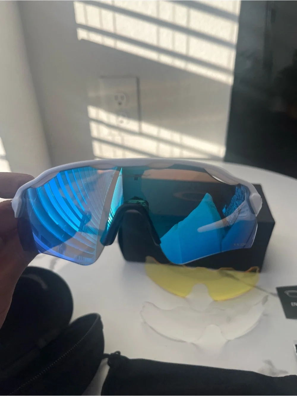 Oakley White Frame Sunglasses with Blue Mirrored Lens